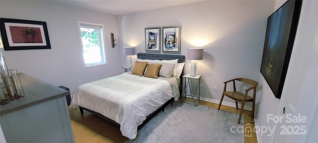 308 Woodfield Dr, Asheville, NC 28803 - bedroom featuring wood finished floors and baseboards