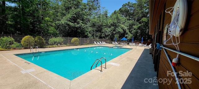 308 Woodfield Dr, Asheville, NC 28803 - community pool with a patio and view of wooded area