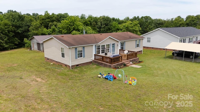 1007 W Cabaniss Rd, Shelby, NC 28150 - back of house featuring crawl space, a yard, a wooden deck, a detached carport, and a shingled roof