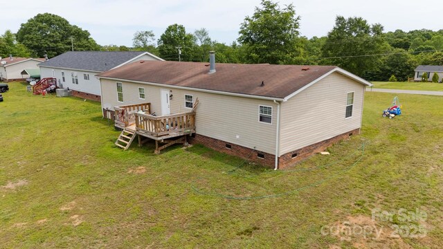 1007 W Cabaniss Rd, Shelby, NC 28150 - rear view of property featuring crawl space, a deck, a lawn, and a shingled roof