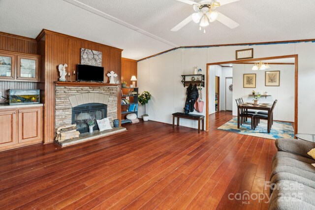 1007 W Cabaniss Rd, Shelby, NC 28150 - living area with ceiling fan, ornamental molding, vaulted ceiling, a glass covered fireplace, and wood finished floors