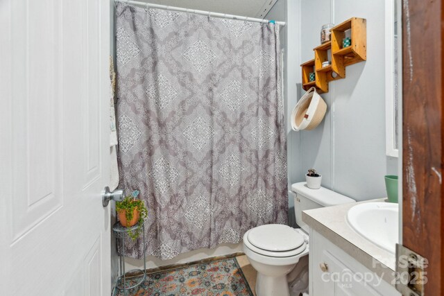 1007 W Cabaniss Rd, Shelby, NC 28150 - bathroom featuring vanity, toilet, and a shower with curtain