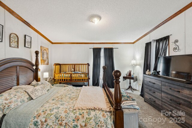 1007 W Cabaniss Rd, Shelby, NC 28150 - bedroom with ornamental molding, carpet, and a textured ceiling