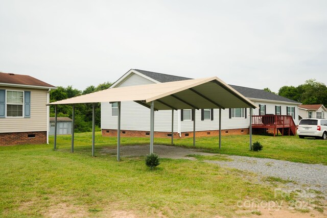 1007 W Cabaniss Rd, Shelby, NC 28150 - view of side of property with crawl space, driveway, a detached carport, and a yard