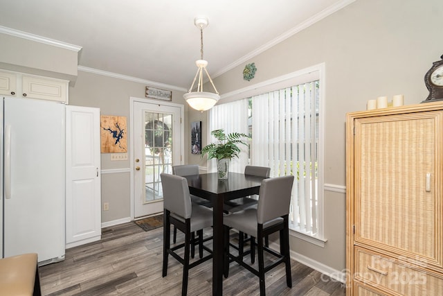 161 Badin Lake Cir, New London, NC 28127 - dining area with wood finished floors, crown molding, and baseboards