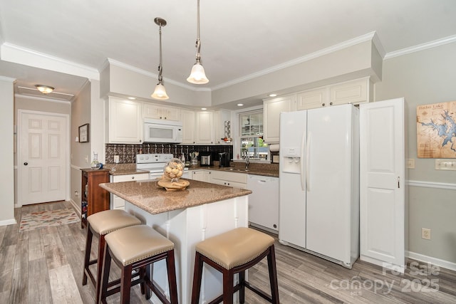 161 Badin Lake Cir, New London, NC 28127 - kitchen with white appliances, light wood-type flooring, crown molding, and white cabinets