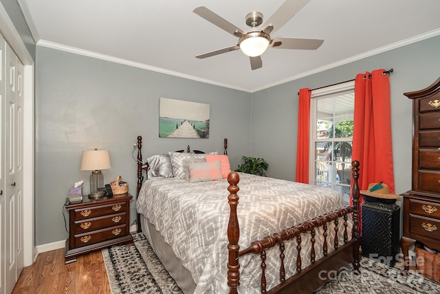 161 Badin Lake Cir, New London, NC 28127 - bedroom with a closet, wood finished floors, crown molding, baseboards, and a ceiling fan