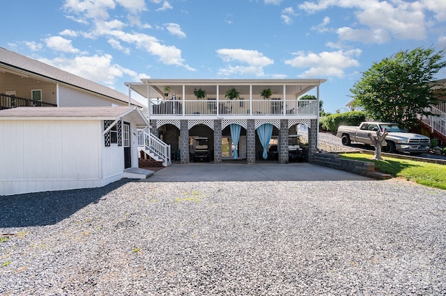 161 Badin Lake Cir, New London, NC 28127 - view of front facade featuring driveway, stairway, a balcony, and a carport