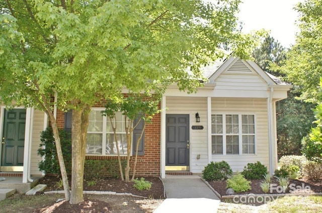 125 Lynch Cir, Mooresville, NC 28117 - view of front facade with brick siding and a porch