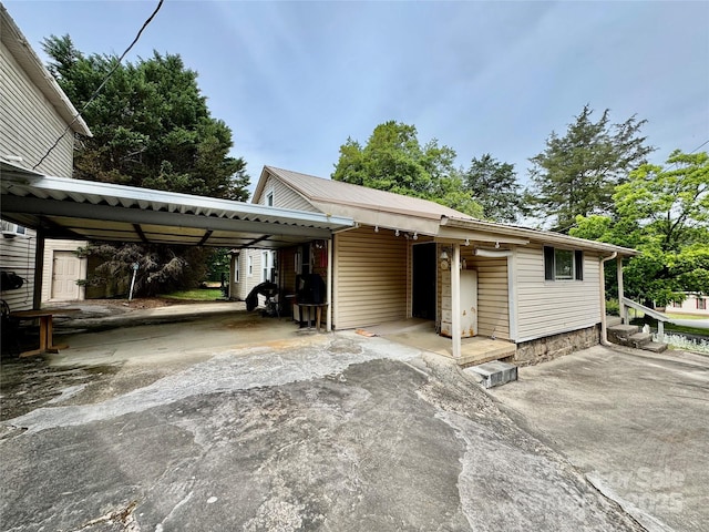 1733 S NC-16 Business Hwy, Stanley, NC 28164 - view of front of house featuring driveway, a carport, and metal roof