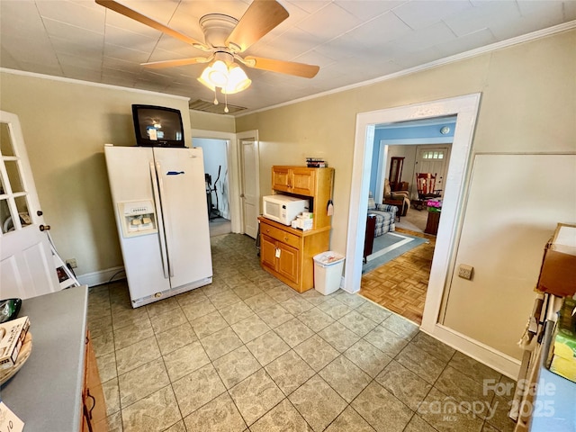 1733 S NC-16 Business Hwy, Stanley, NC 28164 - kitchen with white appliances, ornamental molding, a ceiling fan, and baseboards