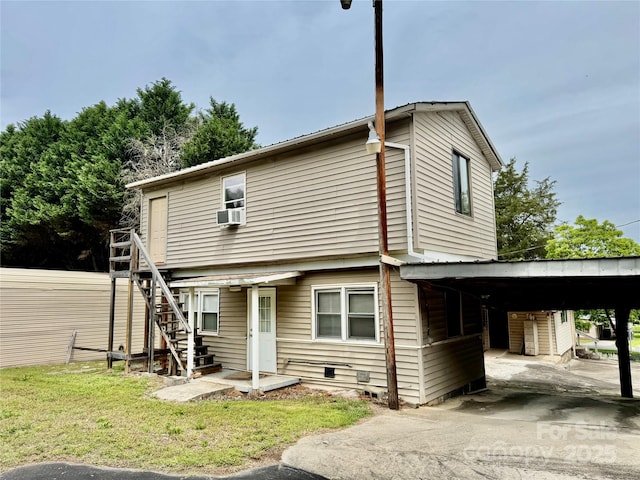 1733 S NC-16 Business Hwy, Stanley, NC 28164 - rear view of house featuring an attached carport, stairway, and cooling unit