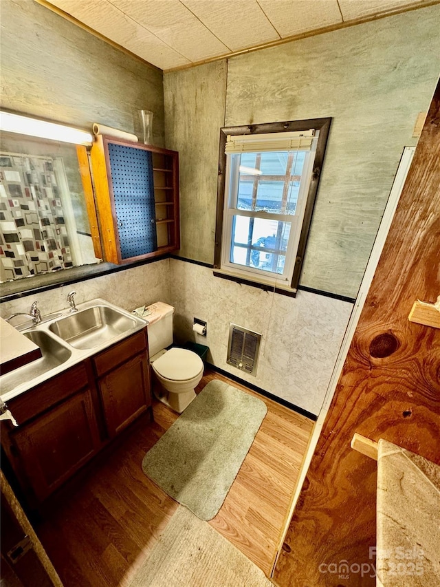1733 S NC-16 Business Hwy, Stanley, NC 28164 - half bathroom with vanity, toilet, and wood finished floors