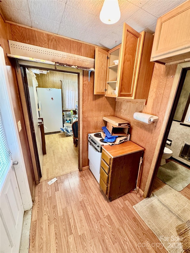 1733 S NC-16 Business Hwy, Stanley, NC 28164 - kitchen with light wood-style floors, wooden walls, light countertops, open shelves, and light brown cabinetry