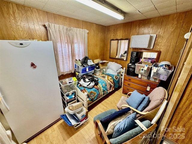 1733 S NC-16 Business Hwy, Stanley, NC 28164 - bedroom with wooden walls, wood finished floors, and freestanding refrigerator