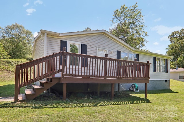 85 Star Flower Rd, Alexander, NC 28701 - back of house with a deck and a lawn