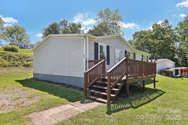 85 Star Flower Rd, Alexander, NC 28701 - view of side of home with a yard and a deck
