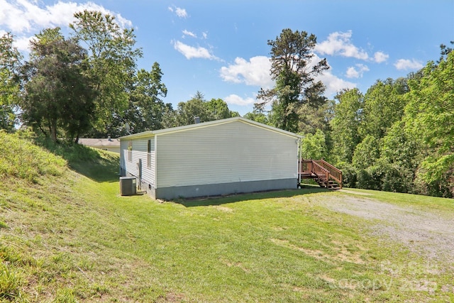 85 Star Flower Rd, Alexander, NC 28701 - view of side of home featuring a yard, central AC, and a deck