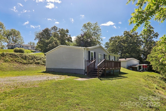 85 Star Flower Rd, Alexander, NC 28701 - view of side of property featuring a deck and a lawn