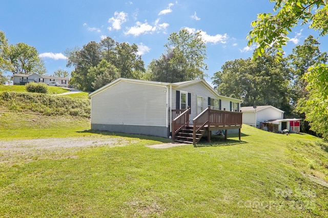 85 Star Flower Rd, Alexander, NC 28701 - view of side of home featuring a wooden deck and a lawn