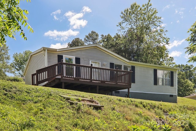 85 Star Flower Rd, Alexander, NC 28701 - rear view of property with a wooden deck