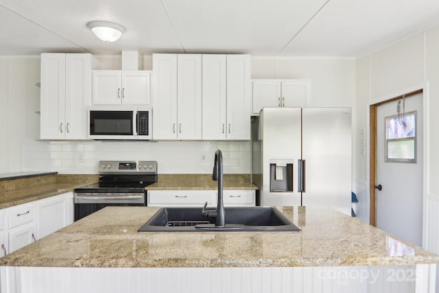85 Star Flower Rd, Alexander, NC 28701 - kitchen with stainless steel appliances, a sink, and white cabinetry