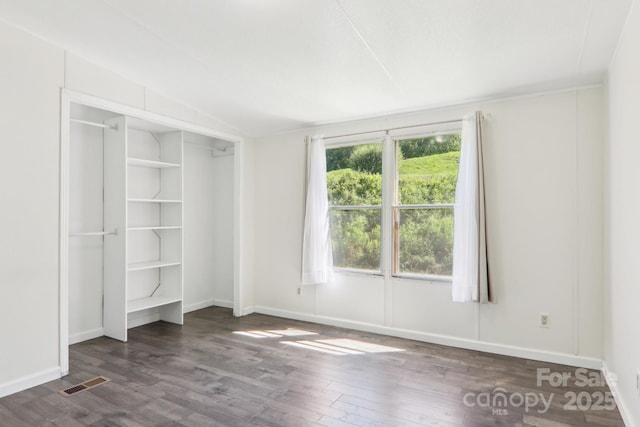 85 Star Flower Rd, Alexander, NC 28701 - unfurnished bedroom with dark wood-type flooring, baseboards, and vaulted ceiling