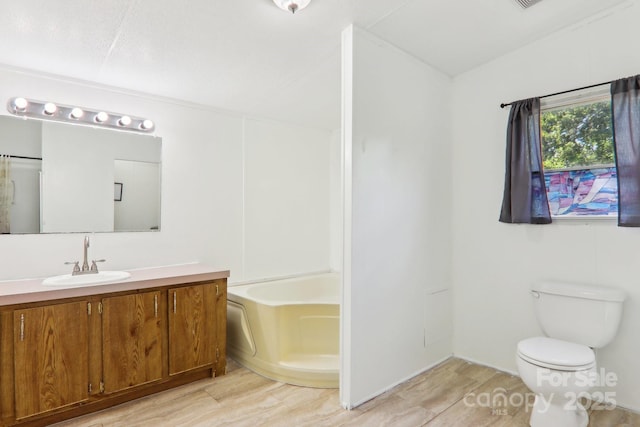 85 Star Flower Rd, Alexander, NC 28701 - full bathroom with vanity, toilet, wood finished floors, and lofted ceiling
