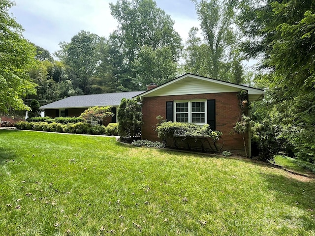 38 Westridge Dr, Asheville, NC 28803 - ranch-style home featuring a front yard, brick siding, and a chimney