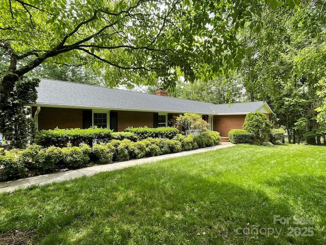 38 Westridge Dr, Asheville, NC 28803 - ranch-style home with brick siding, a chimney, and a front lawn