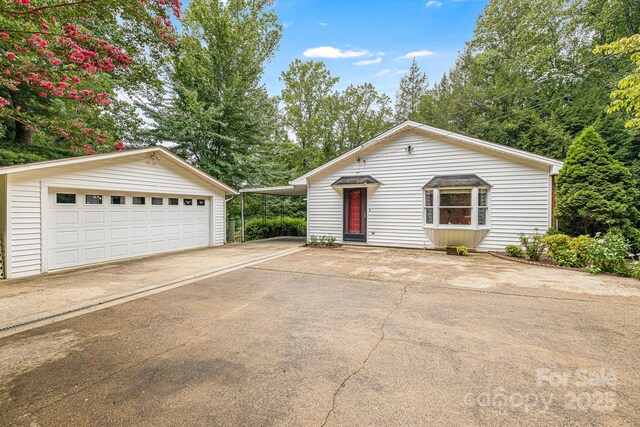 38 Westridge Dr, Asheville, NC 28803 - view of front of property featuring an outdoor structure and a garage