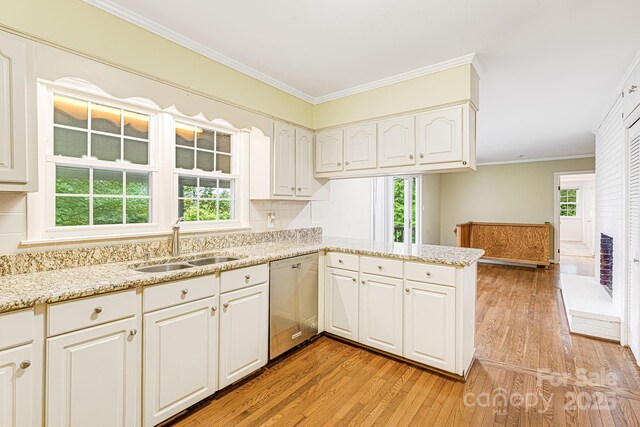 38 Westridge Dr, Asheville, NC 28803 - kitchen featuring dishwasher, a sink, light wood finished floors, white cabinetry, and a peninsula