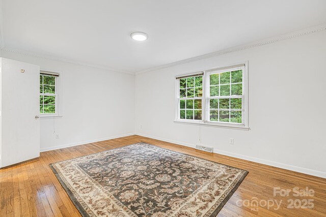 38 Westridge Dr, Asheville, NC 28803 - unfurnished room featuring crown molding, light wood-style flooring, and baseboards