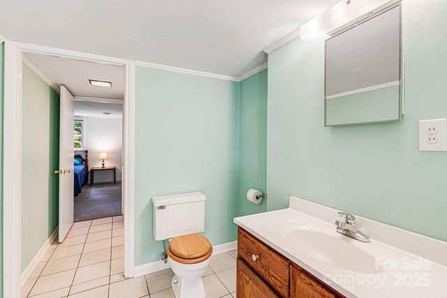 38 Westridge Dr, Asheville, NC 28803 - bathroom featuring vanity, toilet, tile patterned flooring, ornamental molding, and baseboards