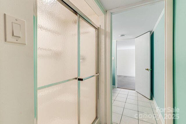 38 Westridge Dr, Asheville, NC 28803 - full bath featuring a stall shower, tile patterned flooring, and baseboards