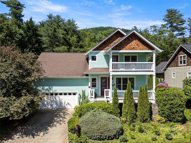 7 Oakhaven Ter, Asheville, NC 28803 - view of front of house with covered porch, concrete driveway, an attached garage, a balcony, and roof with shingles