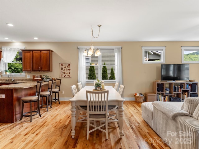 7 Oakhaven Ter, Asheville, NC 28803 - dining room featuring light wood-type flooring, recessed lighting, a chandelier, and baseboards