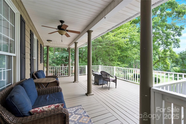 832 Kemp Rd, Mooresville, NC 28117 - deck with ceiling fan and view of wooded area