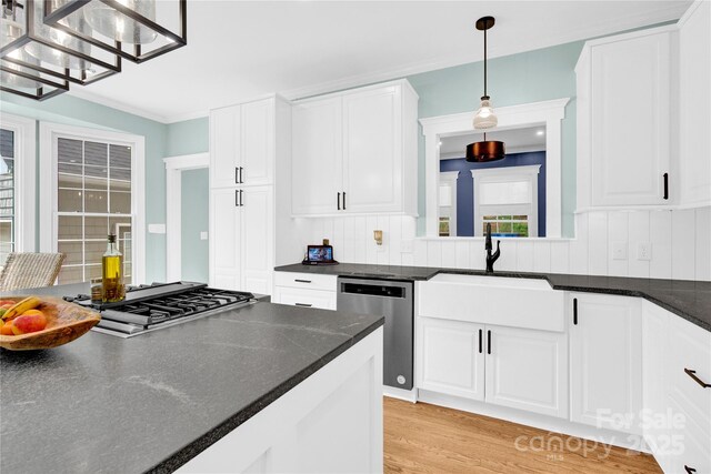 832 Kemp Rd, Mooresville, NC 28117 - kitchen featuring stainless steel appliances, hanging light fixtures, light wood-type flooring, and white cabinetry