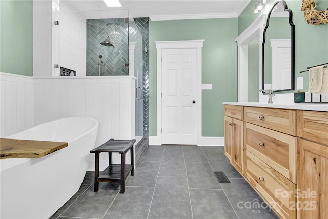 832 Kemp Rd, Mooresville, NC 28117 - full bathroom with a stall shower, vanity, a freestanding bath, tile patterned flooring, and ornamental molding