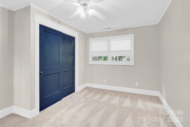 832 Kemp Rd, Mooresville, NC 28117 - unfurnished bedroom featuring carpet, ornamental molding, and a ceiling fan