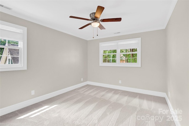 832 Kemp Rd, Mooresville, NC 28117 - empty room featuring light colored carpet, healthy amount of natural light, a ceiling fan, and ornamental molding