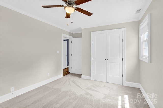 832 Kemp Rd, Mooresville, NC 28117 - unfurnished bedroom with light carpet, crown molding, a closet, and ceiling fan