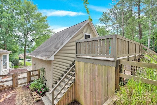 832 Kemp Rd, Mooresville, NC 28117 - view of side of home featuring roof with shingles, stairway, and a wooden deck
