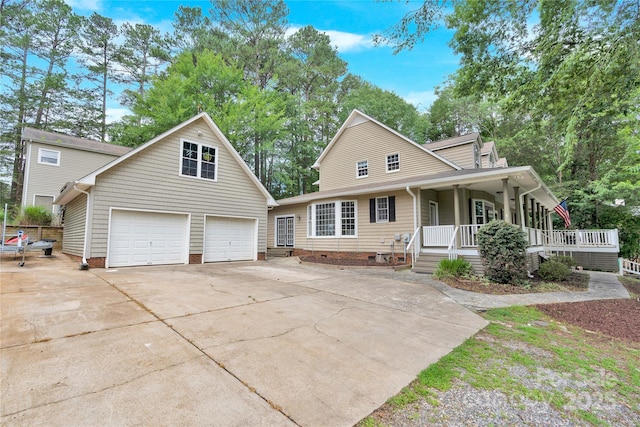 832 Kemp Rd, Mooresville, NC 28117 - view of front facade featuring a porch, driveway, an attached garage, crawl space, and an outbuilding