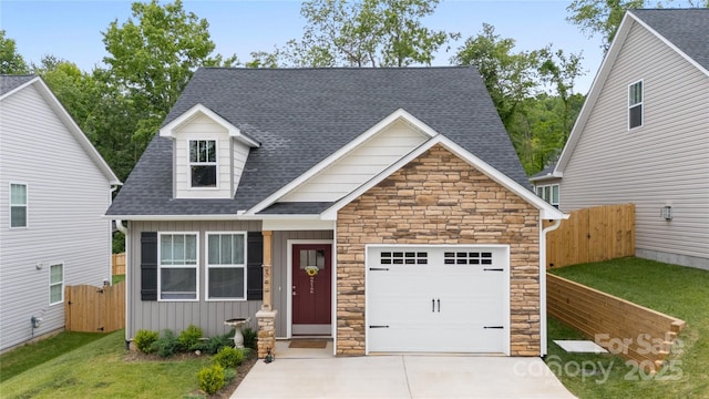 212 Rockrose Ct, Asheville, NC 28803 - view of front of house with roof with shingles, stone siding, board and batten siding, an attached garage, and driveway
