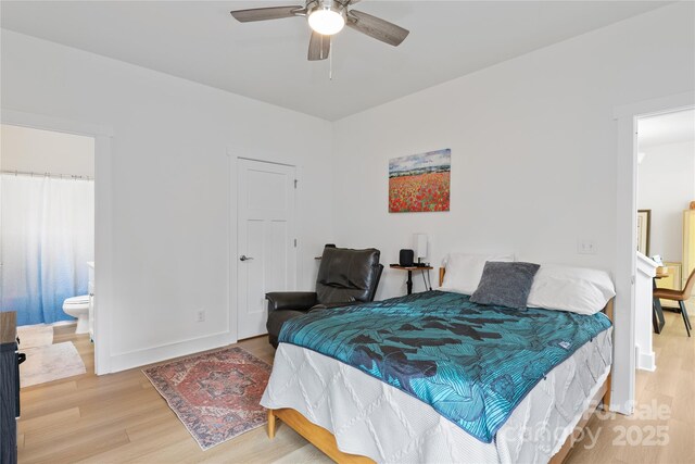 212 Rockrose Ct, Asheville, NC 28803 - bedroom with wood finished floors, baseboards, connected bathroom, and a ceiling fan