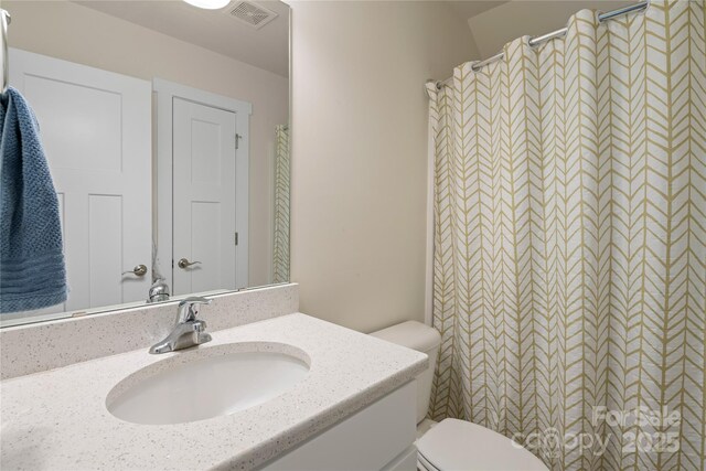 212 Rockrose Ct, Asheville, NC 28803 - full bathroom with toilet, vanity, and a shower with shower curtain