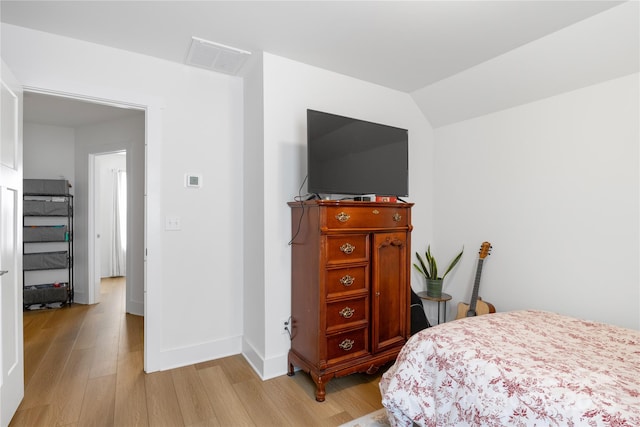 212 Rockrose Ct, Asheville, NC 28803 - bedroom with light wood finished floors, baseboards, and lofted ceiling