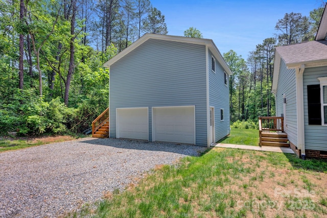 226 Stockwood Ln, Stanley, NC 28164 - view of side of property with gravel driveway and an attached garage